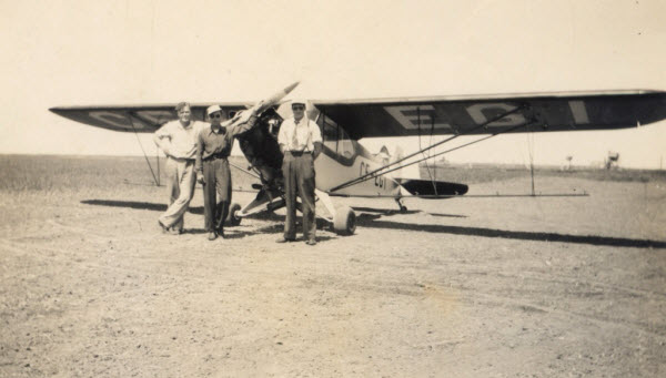 L–R: Art Davis, John Howe and Bob MacKnight, with Prairie Flying's second airplane, a 65 hp Piper J3 Cub