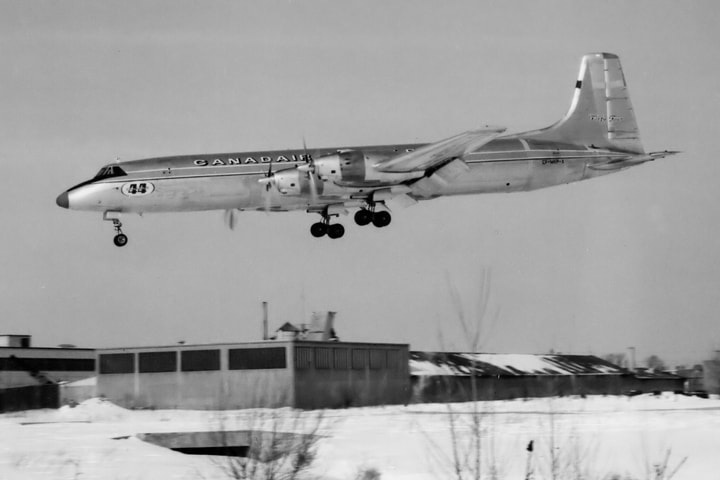 	
The prototype swing-tail version of the Canadair CL-44, CF-MKP-X, is seen landing on a cold winter day at Cartierville. (E.D.)