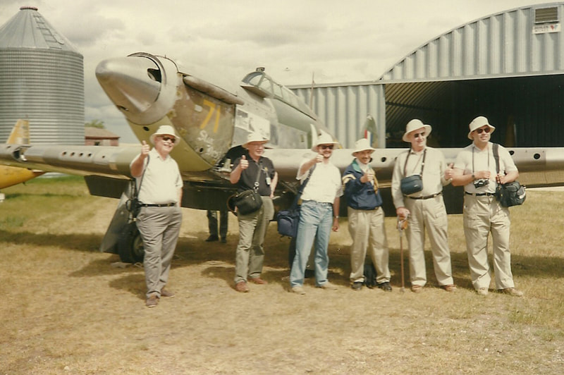 CAHS attendees at the 1993 convention in Saskatchewan model Tilley hats in front of Harry Whereatt's Hurricane. Photo from Angie McNulty