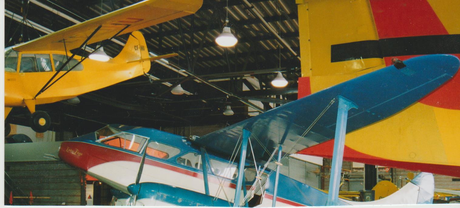 Dan Campbell's Aeronca Champ CF-IHU hangs from the ceiling above the museum's Dragon Rapide