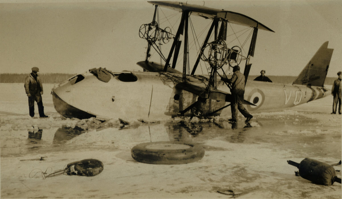 Showing  the Vancouver in various states of dismantlement, as the wings, engines and tail were removed to make the aircraft easier to lift out of the ice.